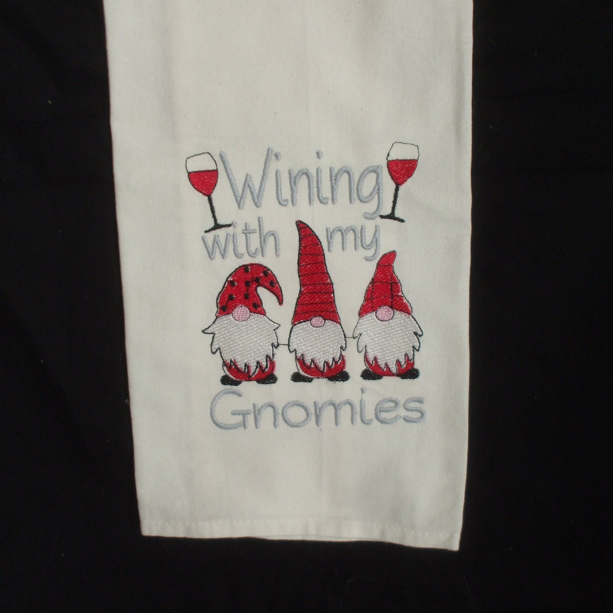 Flour sack tea towel with Santa Gnome in a cup of cocoa | Lee Embroidery LLC